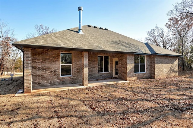 back of property with a patio