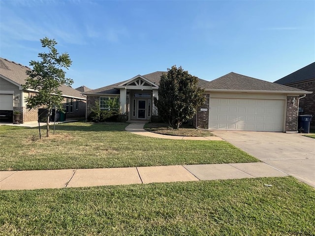 view of front of house featuring a front yard and a garage