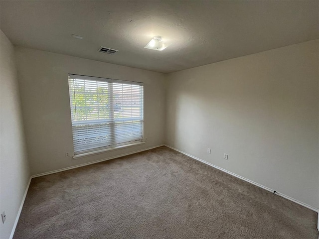 unfurnished room with carpet floors