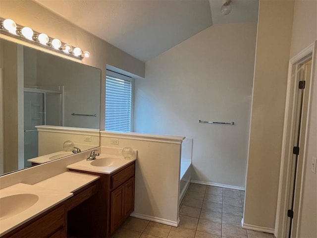 bathroom with tile patterned flooring, vanity, shower with separate bathtub, and vaulted ceiling