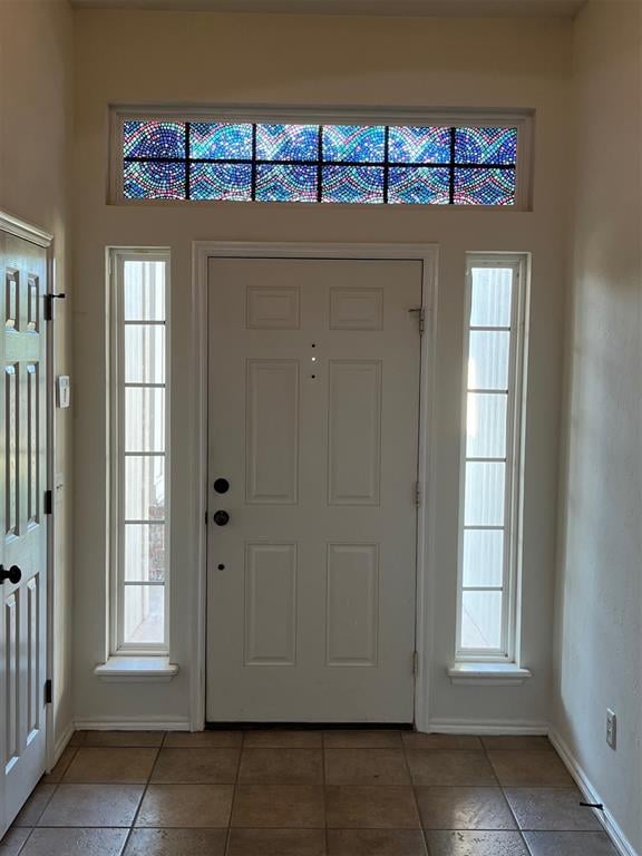 entrance foyer featuring plenty of natural light