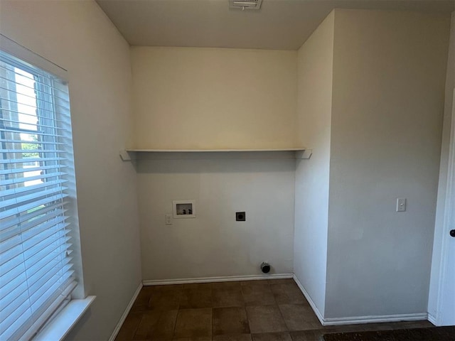 clothes washing area with hookup for an electric dryer and hookup for a washing machine