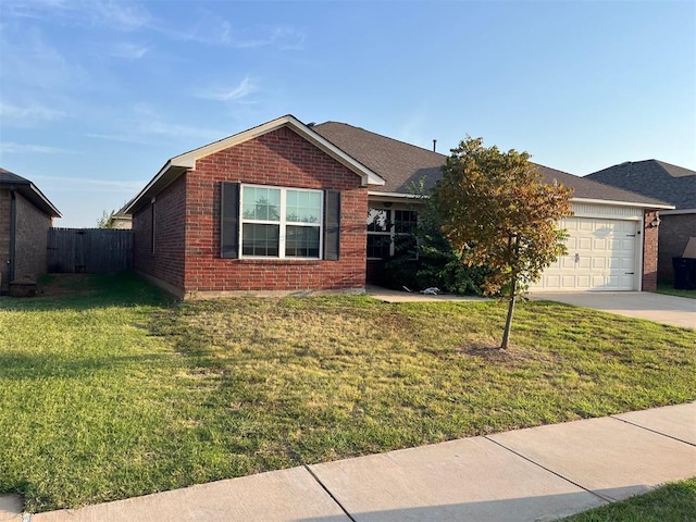 view of front of home with a garage and a front yard