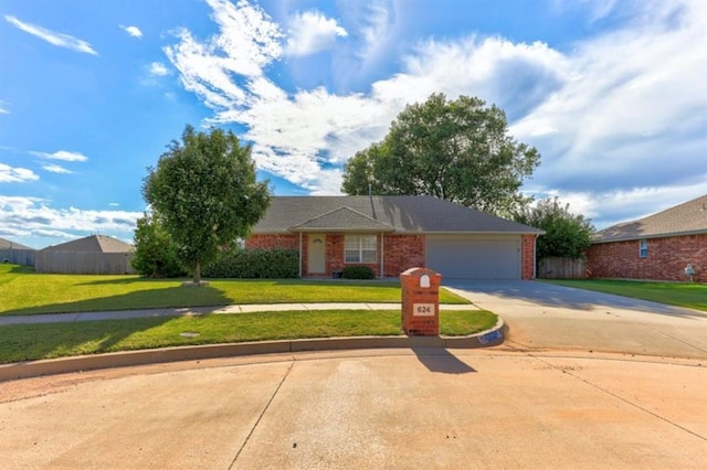 single story home featuring a front yard and a garage