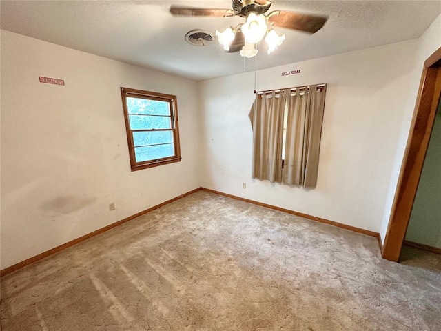 spare room with ceiling fan and carpet floors