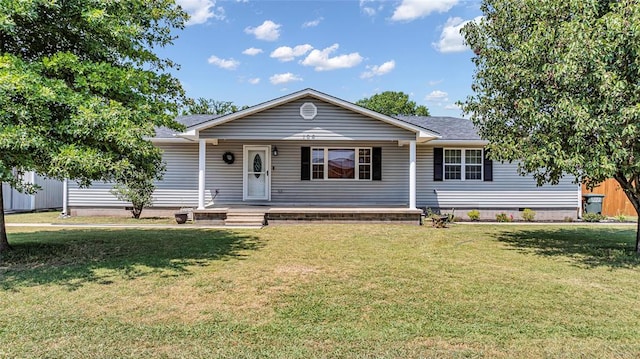 ranch-style home with covered porch and a front lawn