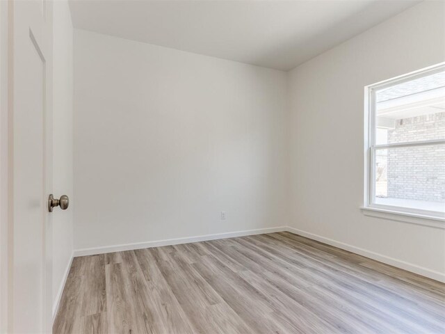 empty room with light wood-type flooring