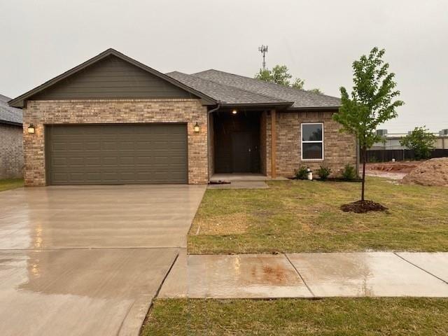 single story home with a garage and a front yard