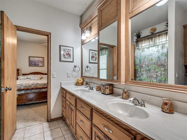 bathroom with tile patterned flooring and vanity