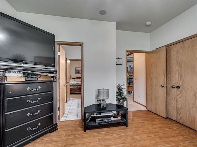 bedroom featuring a closet and light hardwood / wood-style flooring