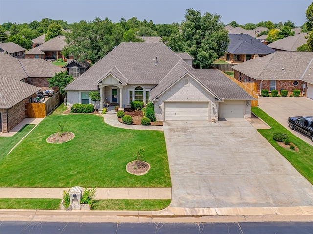 view of front of property with a garage and a front yard