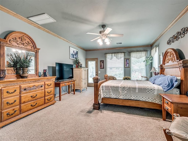 carpeted bedroom featuring crown molding and ceiling fan