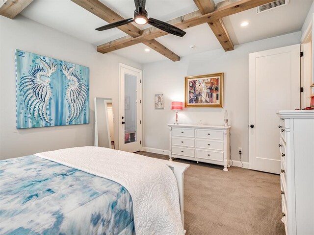 bedroom featuring light carpet, beam ceiling, and ceiling fan