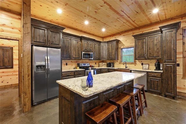 178 Black Jack Trl, Broken Bow, OK 74728 - kitchen with stainless steel appliances, finished concrete flooring, dark brown cabinets, a kitchen island, and wooden ceiling