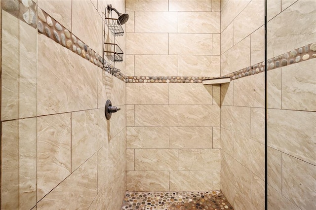 bathroom with a tile shower