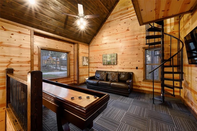 game room with wood walls, ceiling fan, wood ceiling, and vaulted ceiling