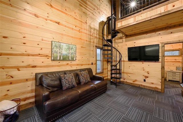 178 Black Jack Trl, Broken Bow, OK 74728 - living area with wood walls, stairway, and dark carpet