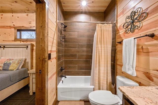 full bathroom with wooden walls, vanity, and shower / bath combo