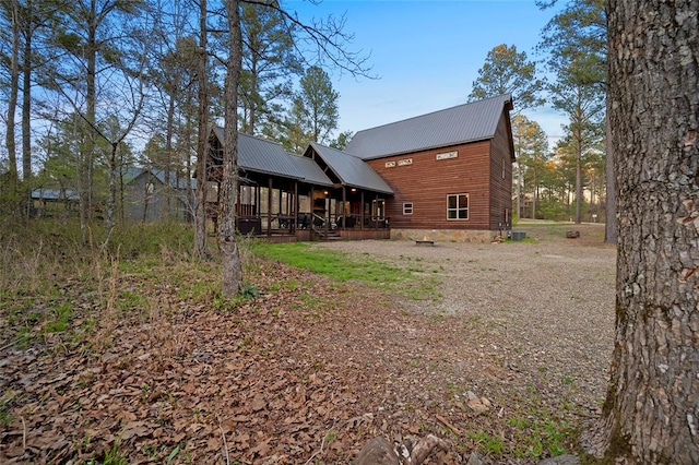 back of house with covered porch