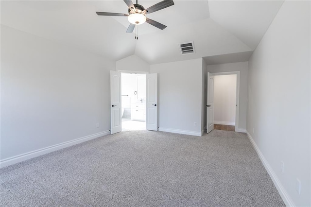 unfurnished bedroom with light carpet, lofted ceiling, and ceiling fan