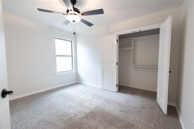 unfurnished bedroom with carpet flooring, ceiling fan, and a closet