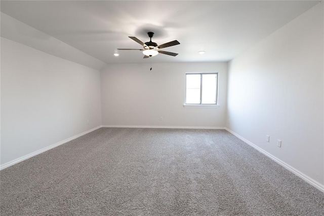 carpeted empty room featuring ceiling fan