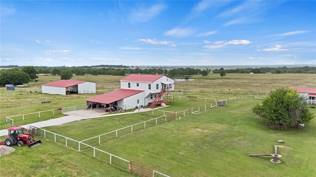 birds eye view of property featuring a rural view