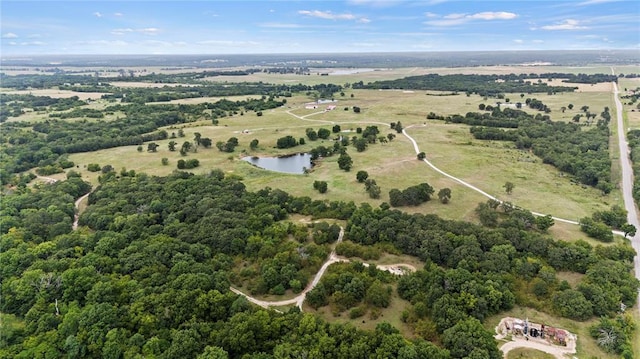 birds eye view of property with a rural view and a water view