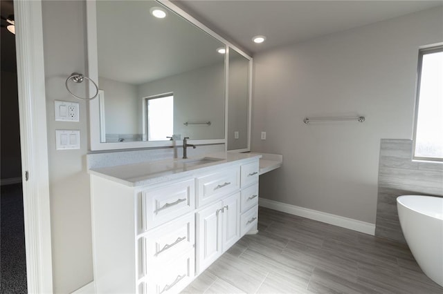 bathroom featuring a bathtub and vanity