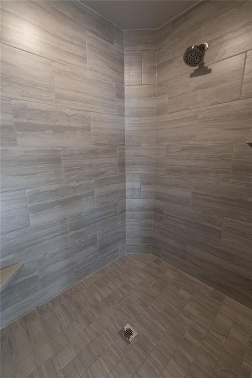 bathroom with tiled shower