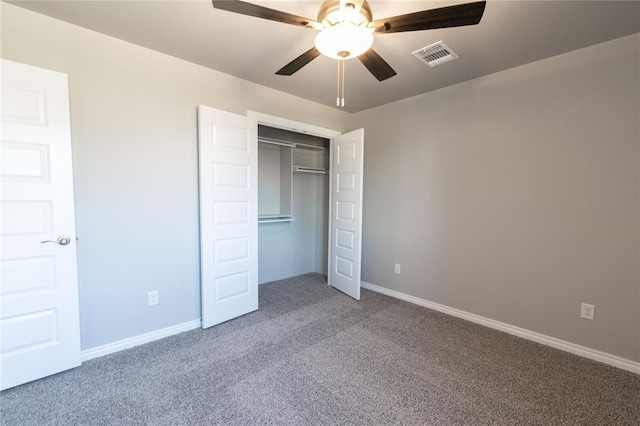 unfurnished bedroom featuring carpet flooring, a closet, and ceiling fan