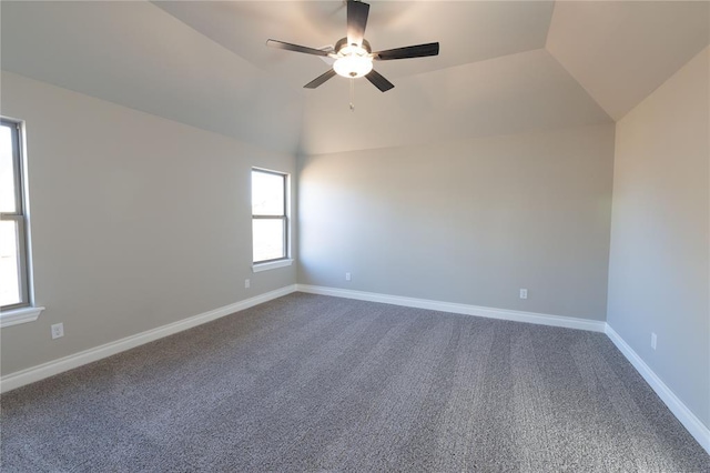 spare room featuring ceiling fan, vaulted ceiling, and carpet floors