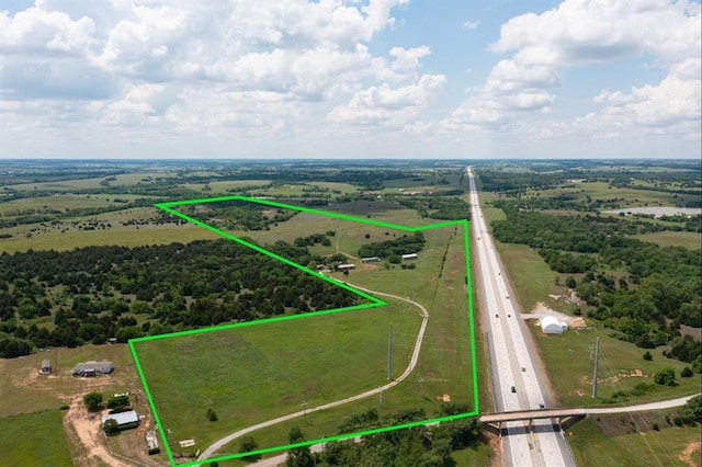667 County Road 1410th Rd, Ninnekah, OK 73067 - aerial view of sparsely populated area featuring property boundaries highlighted and a major roadway