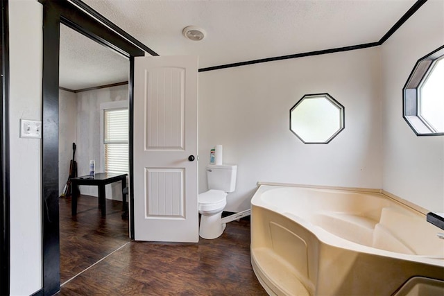 667 County Road 1410th Rd, Ninnekah, OK 73067 - full bathroom with toilet, ornamental molding, a bath, and wood finished floors