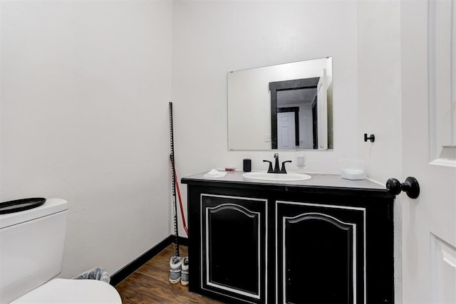 667 County Road 1410th Rd, Ninnekah, OK 73067 - bathroom featuring vanity, toilet, and wood finished floors