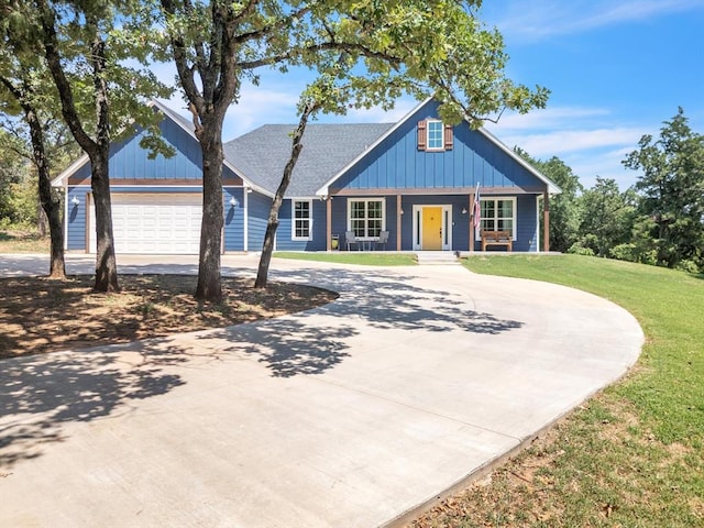 view of front of home featuring a garage and a front lawn