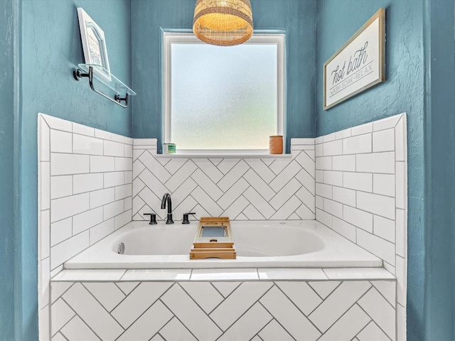 bathroom with tiled tub