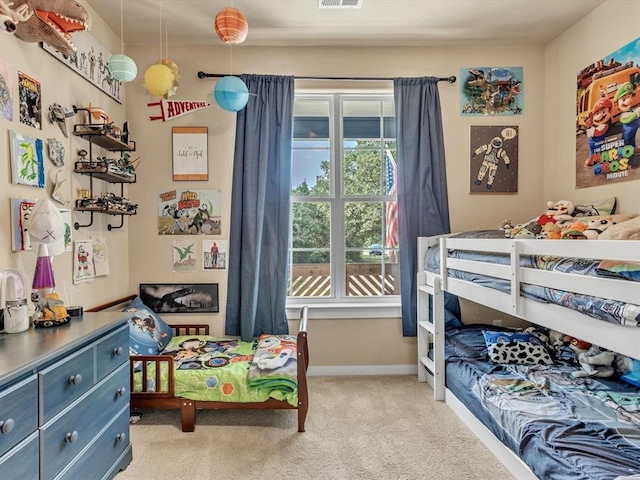 bedroom featuring light carpet