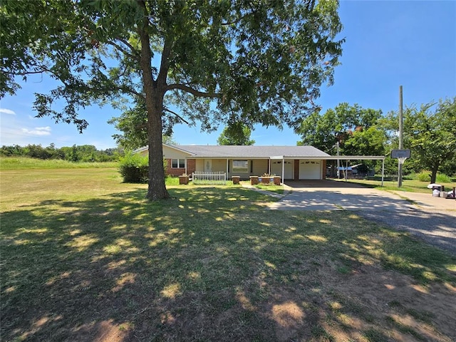 single story home with a front lawn and a carport