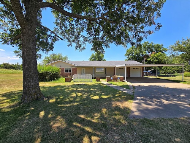 ranch-style house with a carport, a garage, and a front lawn