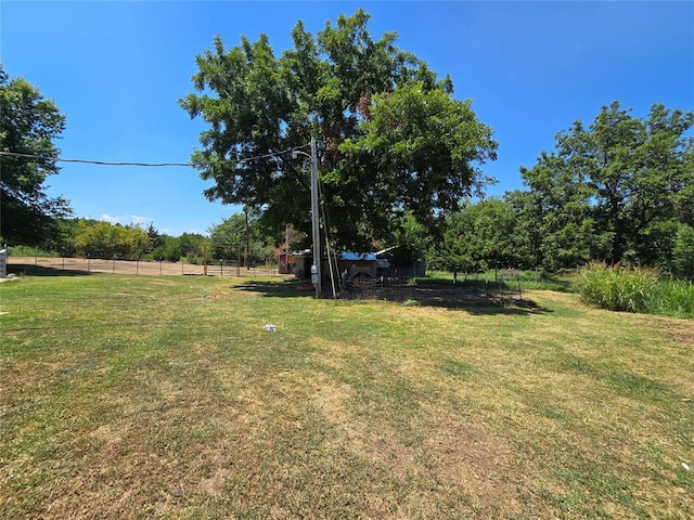 view of yard with a rural view