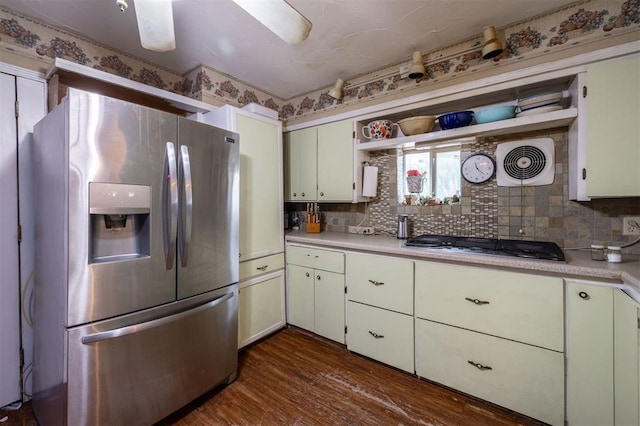 kitchen with backsplash, white cabinetry, dark wood-type flooring, and appliances with stainless steel finishes