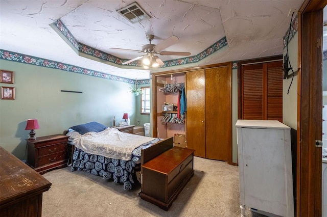 bedroom featuring ceiling fan and light colored carpet