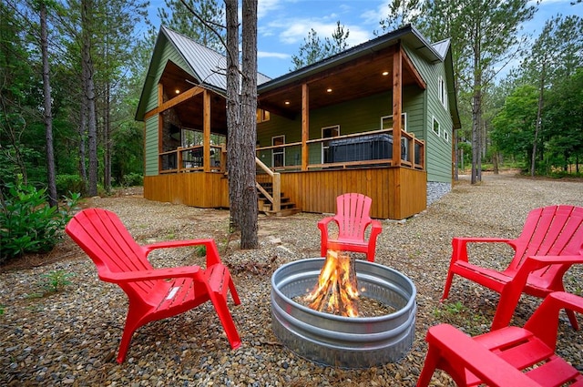 view of patio / terrace with an outdoor fire pit