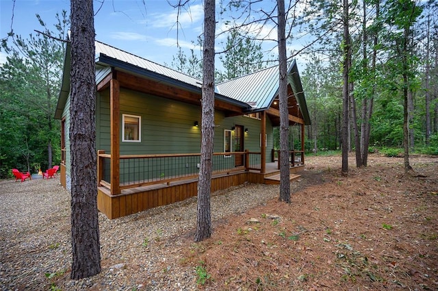 view of property exterior with a porch