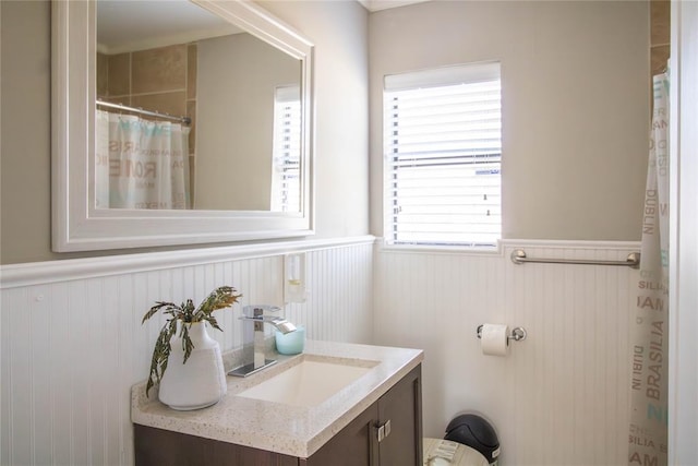 bathroom with plenty of natural light and vanity