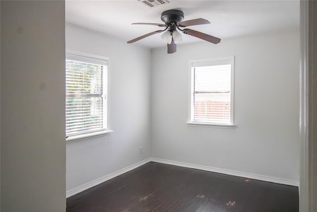 spare room featuring ceiling fan and dark hardwood / wood-style flooring