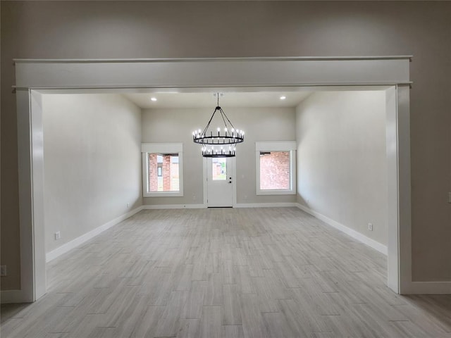 9320 SW 34th St, Oklahoma City, OK 73179 - unfurnished dining area with light wood finished floors, a chandelier, baseboards, and recessed lighting