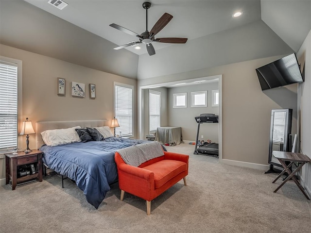 carpeted bedroom featuring multiple windows, lofted ceiling, and ceiling fan