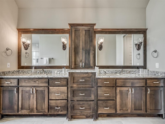 bathroom with tile patterned floors and vanity